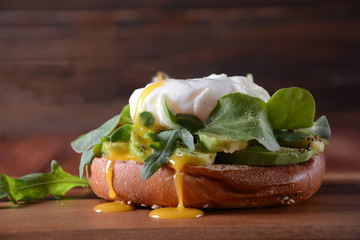 Traditional Spanish andalusian tomato cream soup Salmorejo served with egg, ham jamon, bread in woooden bowl. Summer cold soup concept