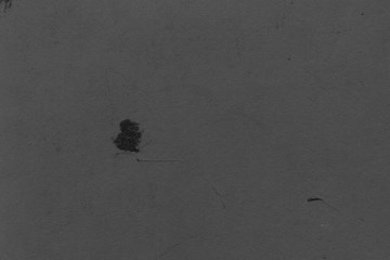 Cardboard black abstract texture close-up. Dark old paper background. Grunge concrete wall. Vintage blank wallpaper.