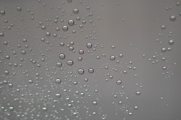 Blurred, raindrops, perched on a glass after a rain background image