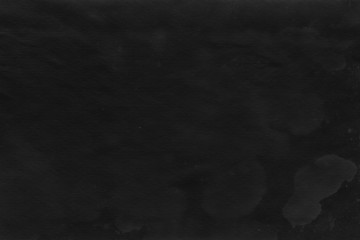 Cardboard black abstract texture close-up. Dark old paper background. Grunge concrete wall. Vintage blank wallpaper.