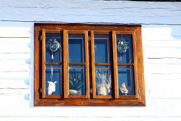 Window on a wooden house in Vlkolinec