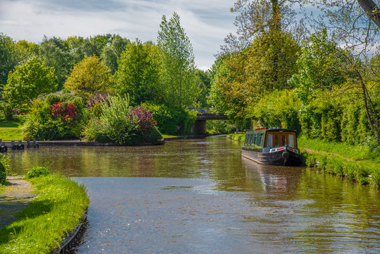 Scenic canal view with mooring narrowboat on the Llangollen Canal near Chirk, Wales,UK