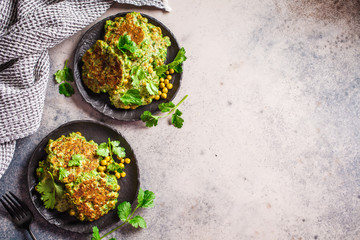 Green broccoli and pea pancakes, top view, copy space. Healthy vegan food concept.