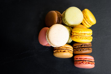 Sweet and colourful french macaroons or macaron on background, Dessert.