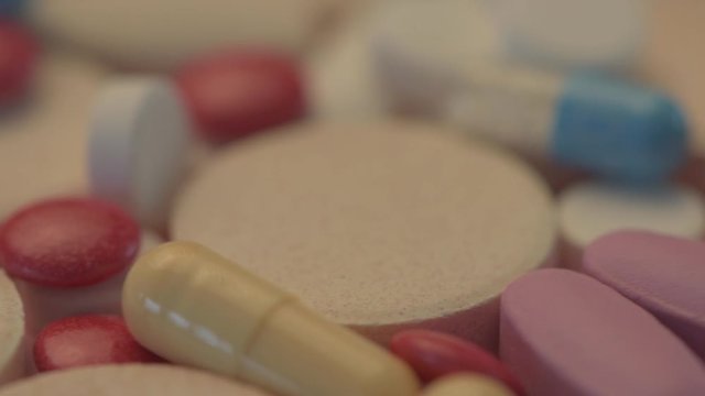 Various medicine pills and tablets, close up dolly shot