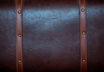 The back surface of a leather suitcase