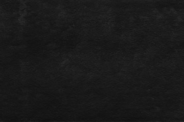 Fototapeta premium Cardboard black abstract texture close-up. Dark old paper background. Grunge concrete wall. Vintage blank wallpaper.