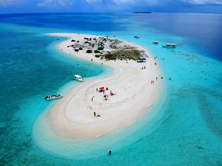 The aerial view of the stunning white sandbank with beautiful sandy beaches of Maldives