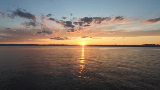 Aerial view drom a drone off a sunset next to St-Lawrence river in Quebec Canada
