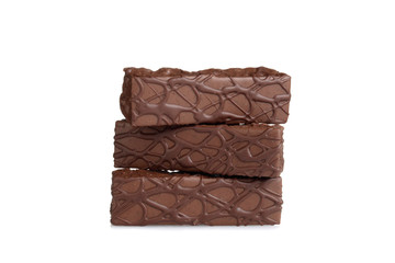 three chocolate bar cakes stacked on white