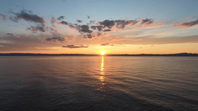 Aerial view drom a drone off a sunset next to St-Lawrence river in Quebec Canada