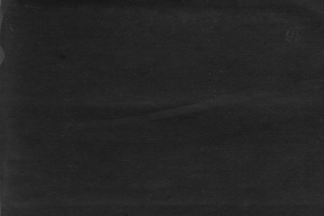 Cardboard black abstract texture close-up. Dark old paper background. Grunge concrete wall. Vintage blank wallpaper.