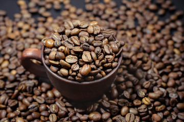 A full cup of coffee beans close-up. Coffee background.