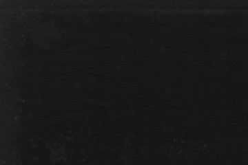 Fototapeta premium Cardboard black abstract texture close-up. Dark old paper background. Grunge concrete wall. Vintage blank wallpaper.