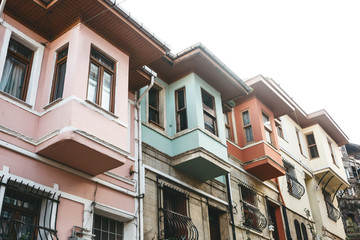Fototapeta na wymiar Ancient traditional apartment buildings in the Balat district of Istanbul in Turkey. The houses in this area were built in the 15-18 centuries, not later.