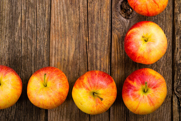 apple fruits frame background, old weathered wood table