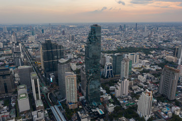 beautiful city view at twilight scene City scape of MahaNakhon building, skyscraper in the Silom/Sathon central business district of Bangkok as the tallest building in Thailand