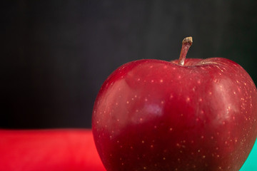 Single natural organic red apple zoom shot