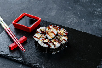 black shale poppy sushi close-up