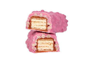 Pink chocolate crispy brocken bar with wildberry taste isolated on the white