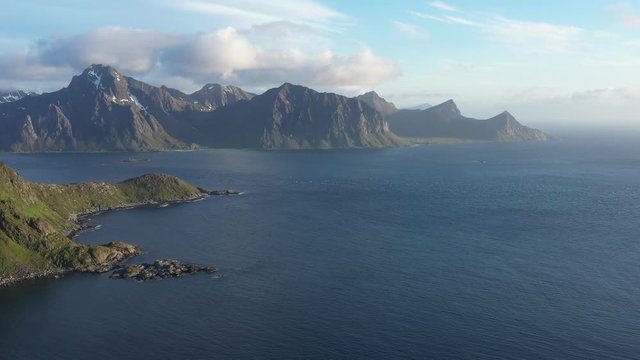 aerial view. flight over the sea,view on the Flakstadoya from Haukland beach and Mannen peak.Lofoten Islands,Norway