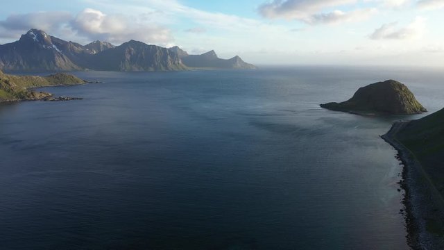 aerial view. flight over the sea,view on the Flakstadoya from Haukland beach and Mannen peak.Lofoten Islands,Norway