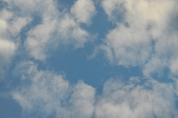 In the blue sky, a small gap in the clouds.