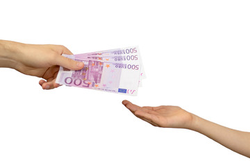 An adult pays a child paper money. The concept of inheritance transfer or payment for minor labor. European currency in denominations of five hundred euros. Transfer of money from hand to hand 