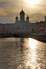 Obraz na płótnie Canvas Isidor Church on the Griboedov Canal at sunset. Saint-Petersburg, Russia