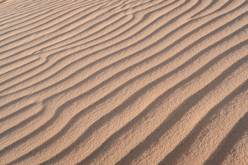 Abstract background and texture of sand waves in desert