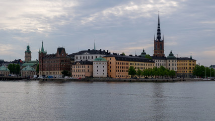 Fototapeta na wymiar City buildings on the waterfront. Evening, summer Stockholm, Sweden.