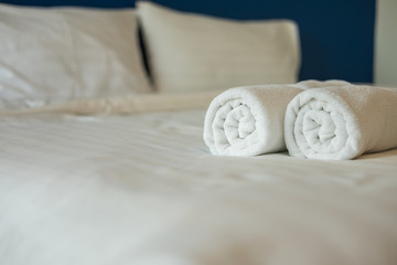 pillows and Bath towel on the bed in the hotel