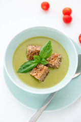 Pea cream soup on the dinner table