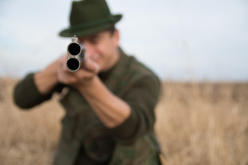 Close Up of a riffle pipe with hunter holding it