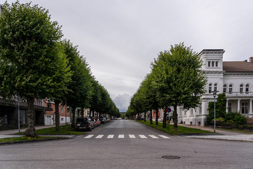 Festningsgata street in Kristiansand Norway with cars parked on the sides of the street