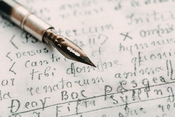 Fountain pen on an ancient handwritten letter. Old story. Retro style.