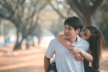 Obraz premium Portrait of young asian couple in love in the forest,Thailand people happy to be together,Valentine day concept