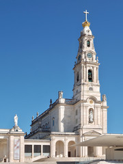 Fototapeta na wymiar Cathedral of Fatima in Portugal near Lisboa with blue sky