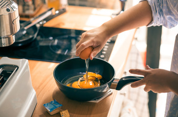 Cooking breakfast on kitchen counter bar in morning