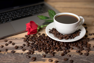 Coffee and roses on the wood floor
