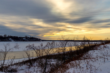 Sunset over the frozen South Saskatchewan River in winter Saskatoon Saskatchewan Canada
