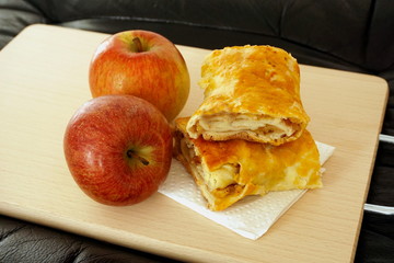 Homemade strudel cake made from organic and natural apples. Sweet roll made from homemade sourdough and apples that are natural and untreated with pesticides