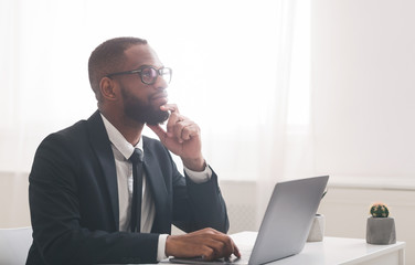 Pensive manager working on financial report in his office