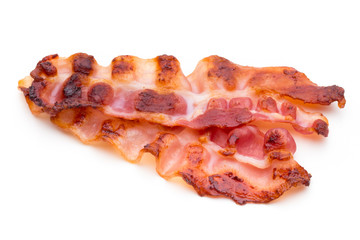Cooked bacon rashers isolated on white.