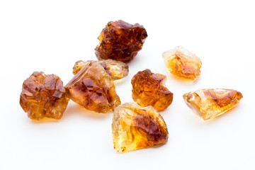 Brown caramelized sugar on white background.