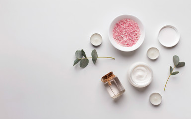 Organic Skin cream jar and Himalayan salt on gray