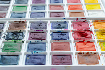 watercolor paints on a white background. Art workshop, art school.