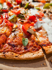 Takeway pizza in the cardboard boxes -  delicious slices ready to enjoy in the sun.