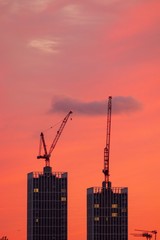 Fototapeta na wymiar construction of a building at sunset