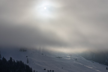 Mountain huts in a snowy landscape in the swiss Alps, Switzerland, Europe